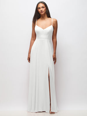 White maxi dress with spaghetti straps, V-neck bodice, and front slit hem