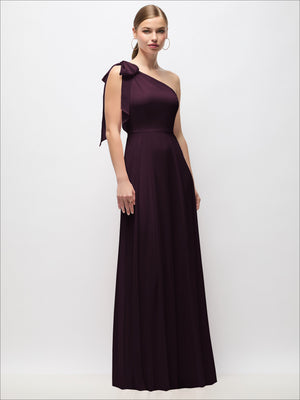 Draped one-shoulder maxi dress with scarf bow, deep plum, front view.