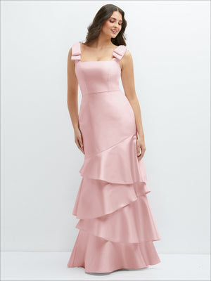 Blush pink bow-shoulder satin maxi dress with tiered asymmetrical skirt, front view
