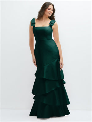 Deep green satin maxi dress with bow-shoulders and asymmetrical tiered skirt