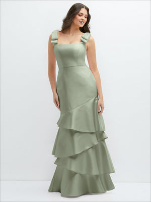 Sage green satin maxi dress with asymmetrical tiered skirt and fitted bodice.