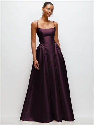 Satin maxi dress in deep plum with scoop neckline, spaghetti straps, and gathered waist.