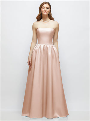 Light blush satin strapless drop-waist gown with full gathered skirt