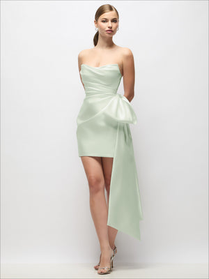 Light green strapless satin mini dress with pleated bodice and long draped tail
