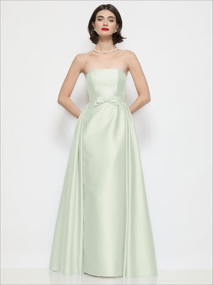 Sage green strapless satin column dress with waist bow detail and gathered bodice