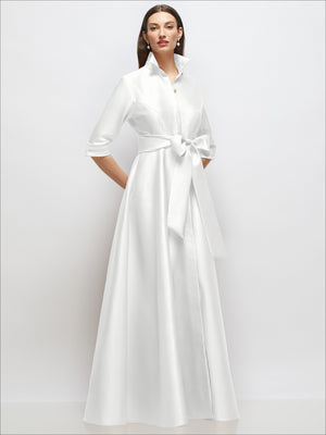 Ivory satin shirt dress with 3/4 sleeves, high collar, waist sash bow, button front, angled view