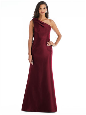 One-shoulder satin trumpet gown in deep burgundy, with draped bow shoulder detail