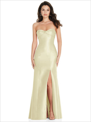 Light yellow strapless trumpet gown with sweetheart neckline and front slit.