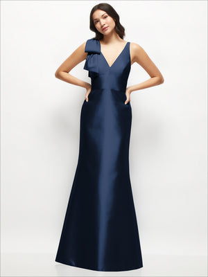 Navy satin trumpet dress with deep V-neck and one-shoulder cascading bow detail