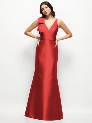 Red satin trumpet dress with deep V-back and one-shoulder cascading bow.