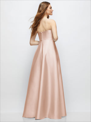 Blush strapless satin gown with full skirt, fitted bodice and hidden back button detail