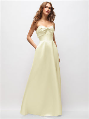 Light yellow satin strapless maxi dress with twisted neckline bow and full skirt