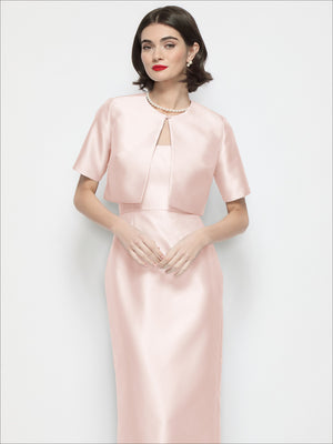 Blush pink satin cropped jacket with jewel neckline, short sleeves, and open front overlay