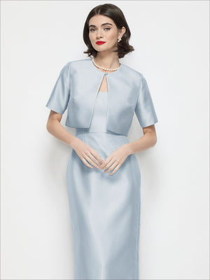 Light blue satin cropped jacket with jewel neckline, short sleeves, and open front overlay