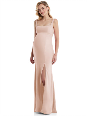 Blush pink maternity trumpet gown with wide straps and square neckline, front slit at hem.
