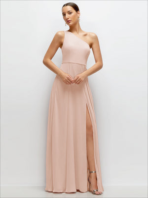 Blush one-shoulder chiffon maxi dress with cinched waist and draped circle skirt, slit hem