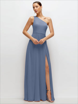 One-shoulder chiffon maxi dress in dusty blue with draped bodice and side slit.