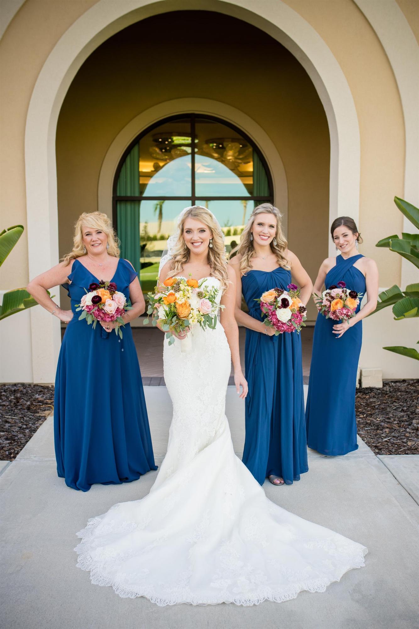 Not keen on a big, expensive wedding? We don't blame you one bit. Learn how to plan a small wedding that keeps the guest count low and the wow factor high! Dessy Real Wedding Photo by William Arthur Photography | Royal Blue Bridesmaid Dresses | Classic Blue Wedding