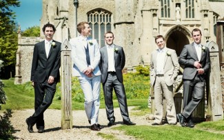 Sam Clayton photography bridegroom with best men outside church