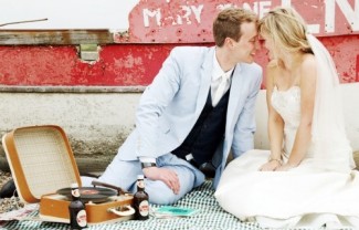 bride and groom with vintage record player