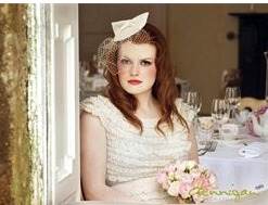 Delicate colours bride with bow style birdcage veil