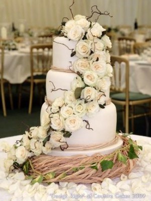 tiered rose wedding cake by couture cakes white tiered rose wedding cake