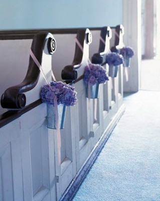 Wedding pew flowers Blue hydrangeas decorating wedding pews