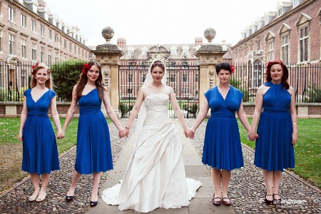 bridesmaids in blue convertible dresses at wedding bridesmaids in blue convertible dresses at wedding