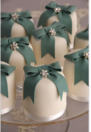 Christmas present style cakes by Maisie Fantaisie Small cakes decorated with green ribbon bows and diamante