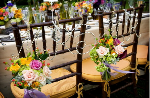 Image via Project Wedding photo by Gene Higa Decorated Chair Backs