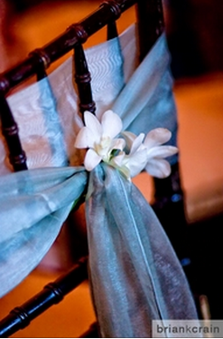 image via briantcrane.com purple sash chair backs with white freesias
