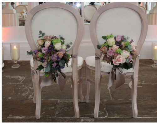 Image via Wild At Heart pink and purple floral chair backs