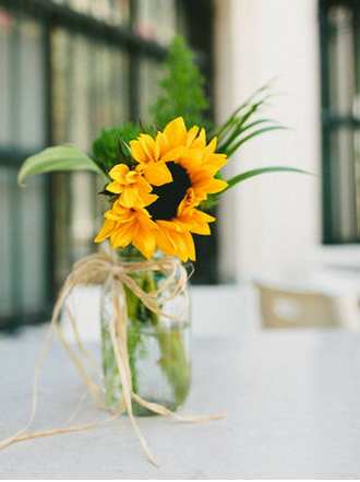 Sunflowers in jam jars as decorations