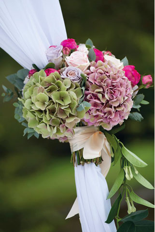 garlands around marquee at garden wedding
