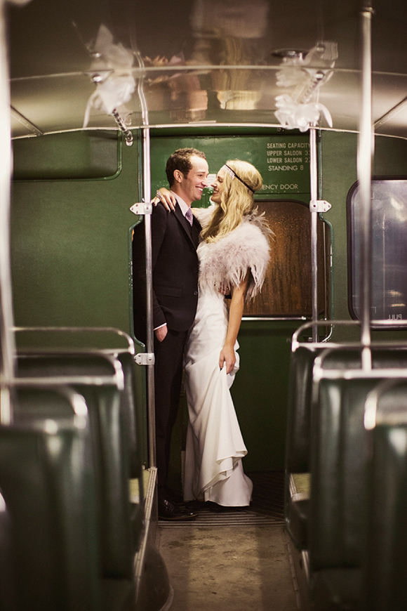 bride in feathered stole with groom