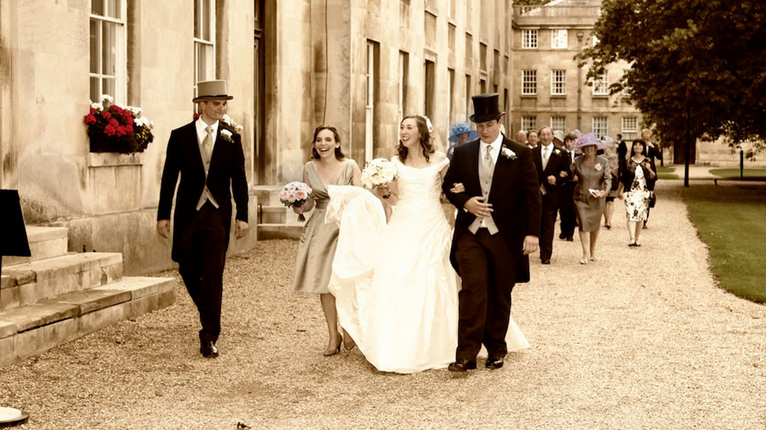 bridal party outside Downing College Cambridge