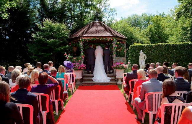 bride and groom marrying outside in Kent